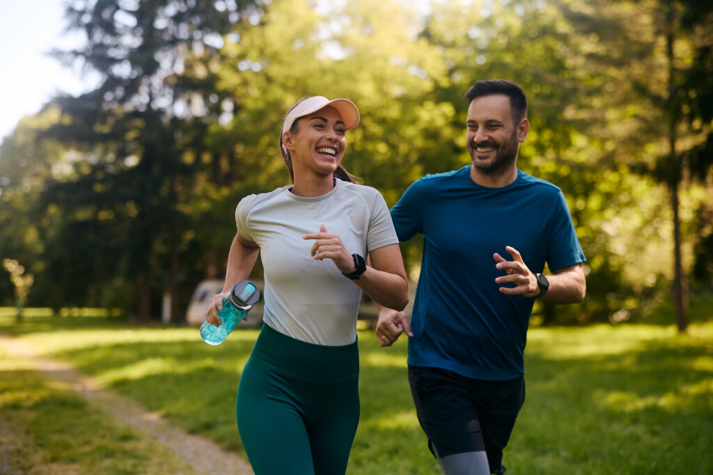 Two people exercising together outdoors on National Exercise Day highlighting low impact exercise and staying active