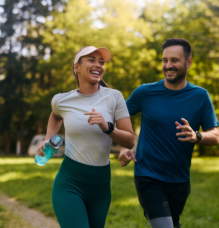 Two people exercising together outdoors on National Exercise Day highlighting low impact exercise and staying active