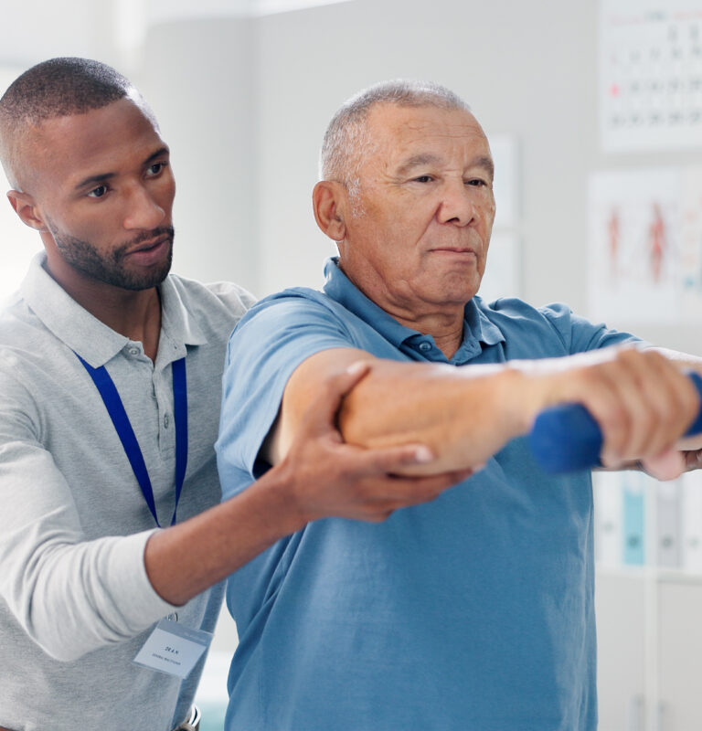 Physical therapist assisting a patient during injury recovery treatment in Suffolk County