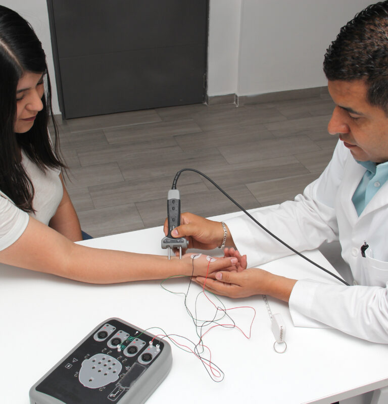 Healthcare provider performing an EMG test on a patient's arm to evaluate nerve and muscle function after injury