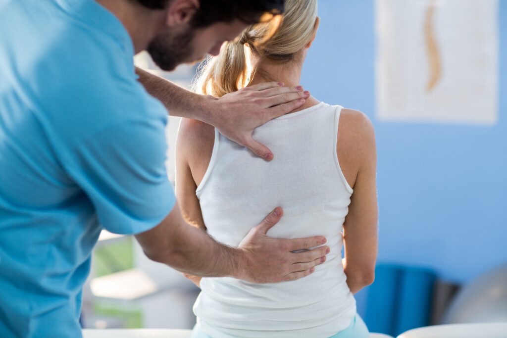 Nerve-Flossing-2 Physical therapist evaluating a patient with nerve-related symptoms and mobility concerns.