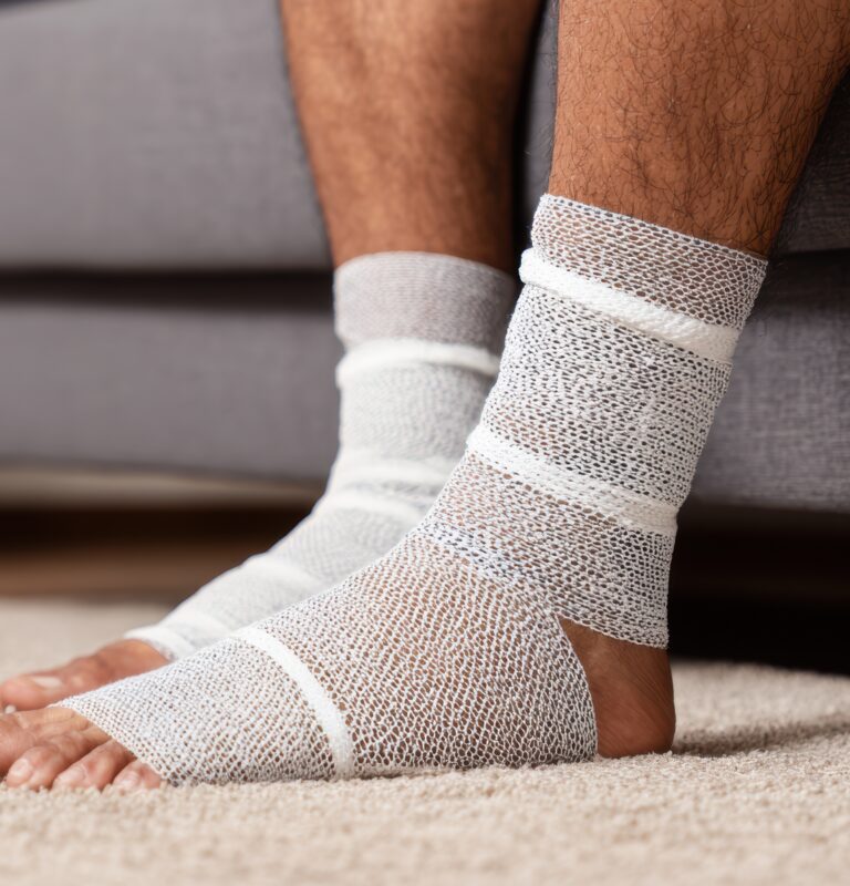 Athlete wearing an ankle brace while recovering from a musculoskeletal injury.