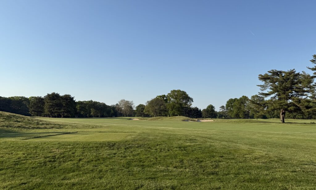 Golfers teeing off at a Long Island golf course during golf season