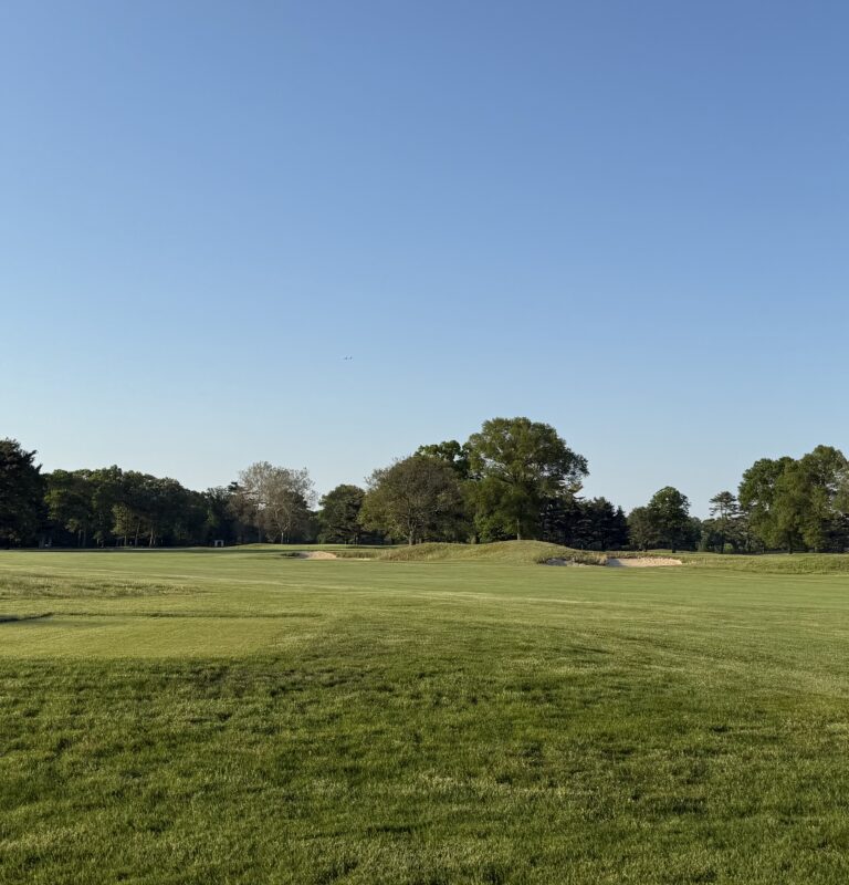 Golfers teeing off at a Long Island golf course during golf season