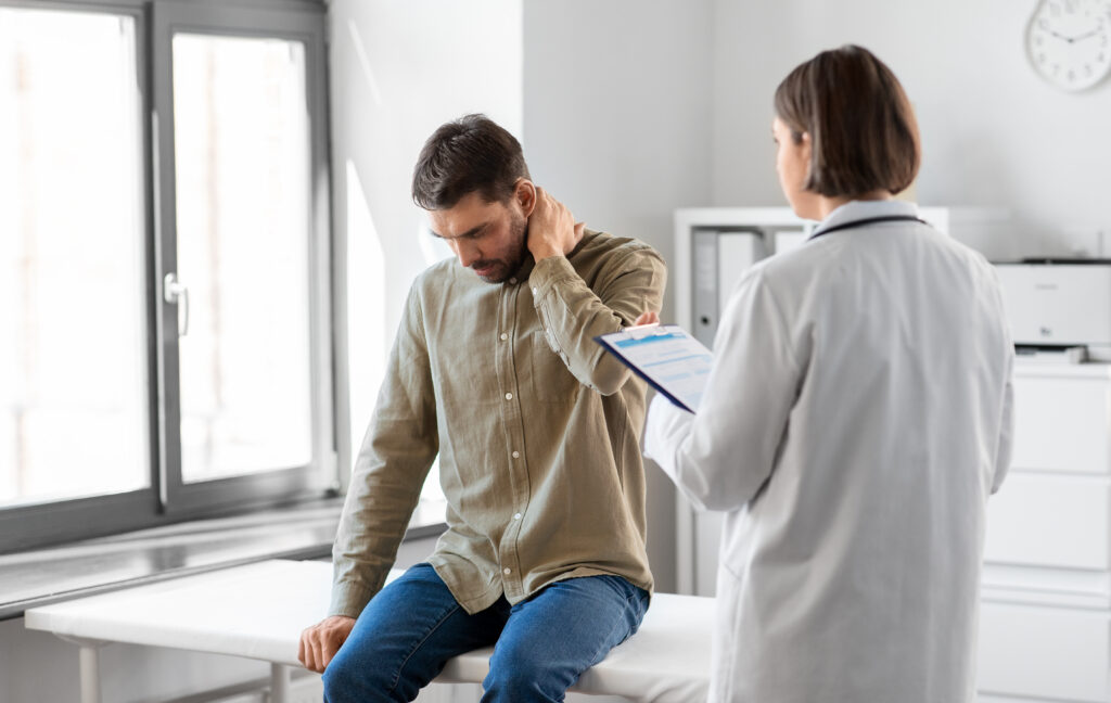 Medical Evaluation for Persistent Neck Pain After Sleeping Patient discussing persistent neck pain after sleeping with a healthcare provider during a medical evaluation.